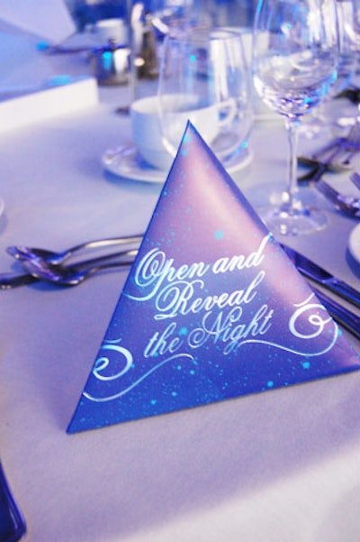 Menus were folded into pyramids and invited guests to 'Open and Reveal the Night.'