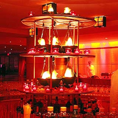 Susan Edgar Design created a specialty bar with three circular tiers festooned with faux flame lamps and dozens of votive candles for the American Theatre Wing's Tony Awards post-ceremony supper ball at Rockefeller Center.