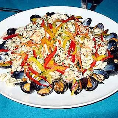 A summery buffet spread including platters of shrimp, clams, mussels and calamari was served by Restaurant Associates.