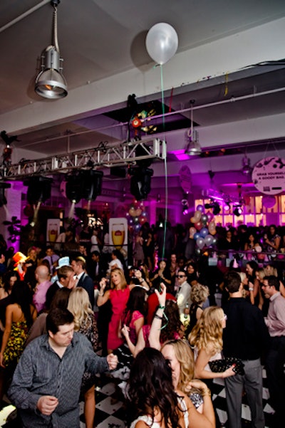 The checkered dance floor filled up quickly on the showroom level of Andrew Richard Designs.