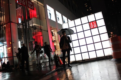 The retailer stationed two of its illuminated cubes on East 54th Street as part of the exterior signage for the Thursday night party. Guests lined much of the length of the Midtown street to get into the event.