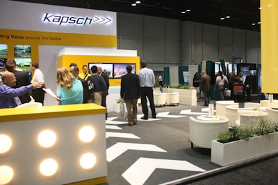 Kapsch used contemporary white furniture and bright yellow accents at its booth, with directional arrows on the floor a not-so-subtle nod to the transportation focus of the event.