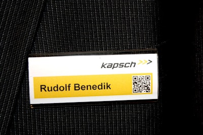 Austrian company Kapsch added Q.R. codes to name tags worn by staff at its booth. Attendees could scan the code with their smartphones to get a link to information about the company's products.