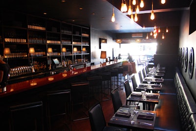 The wine bar on the main floor can seat 40 or accommodate 120 for cocktails. During the summer, large garage door windows open to Bloor Street.