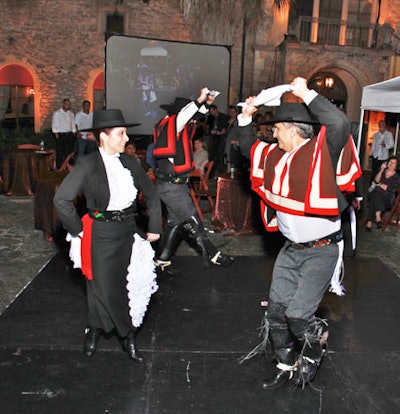 Dancers performed the tango and rhythmic folk dances throughout the evening, both inside and outside the estate.