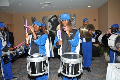 With horns, a 25-person drum line, and color guard, Dillard High School's 140-piece marching band led guests from the cocktail reception to the main ballroom.