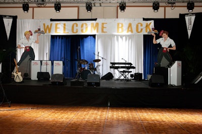 Organizers decorated the ballroom to look like a prom in a high school gymnasium.