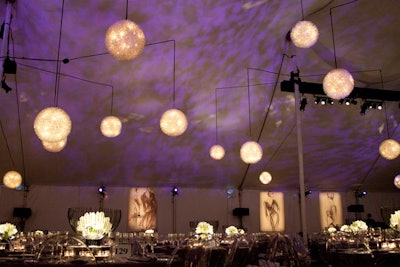 The ceiling of the tent held circular, silver wire chandeliers that were 18 or 24 inches in diameter. Reproductions of Antonio Lopez sketches hung on the walls.