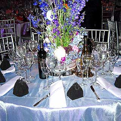 Tables were covered with pearlized pink and turquoise tablecloths to mark the awards 30th anniversarya milestone marked by pearls.