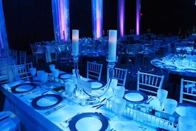 White suede tables filled the dining area. Candelabras and mirrored votive boxes dressed up the tables.