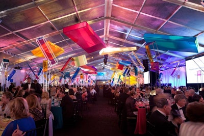 Heffernan Morgan Ronsley handled decor. Centerpieces were four-to-eight-feet-tall steel structures with Piet Mondrian-inspired panels in neon pink, amber, and peacock and royal blues.