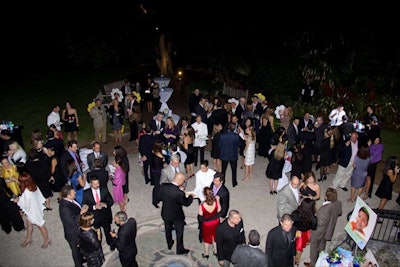 Guests gathered in the Fairchild Tropical Garden's outdoor rotunda for cocktails provided by sponsors Bacardi and Agoston Wine.