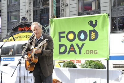 Tom Chapin, liberal advocacy singer (and brother of Tom), debuted his Food Day anthem, which told us that 'An apple should be eaten under a tree' at the Times Square Eat In.