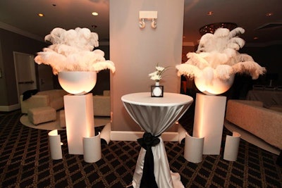 Oversize white feathers played into the '60s-inspired decor.