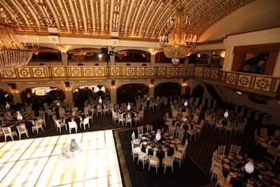 After dinner, guests danced to the Becca Kaufman Orchestra on an illuminated floor. Projection screens in the room projected films and video loops from I Do Films and Leap Weddings.