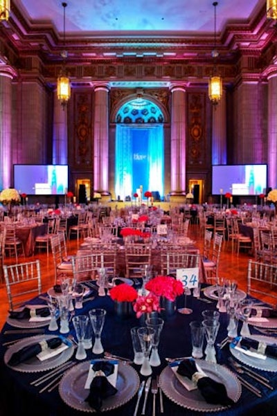 Cloth Connection draped the tables in either navy blue and silver linens, accented by silver chiavari chairs.