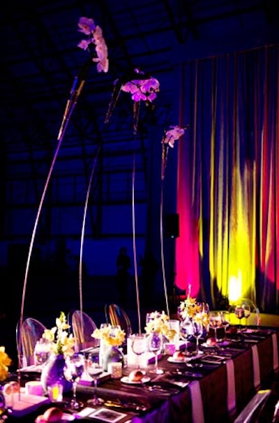 Five-foot-tall flower arrangements decorated rectangular head tables.