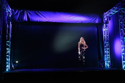 The show involved three-dimensional holographic models, who were wearing items from the brand's latest collection, appearing and dissolving in mid air.