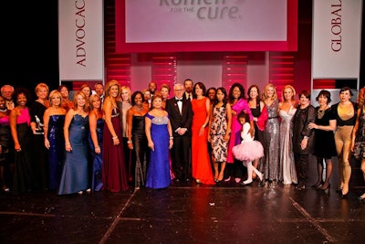 The presenters, entertainment acts, and award winners posed for a group photo on stage.