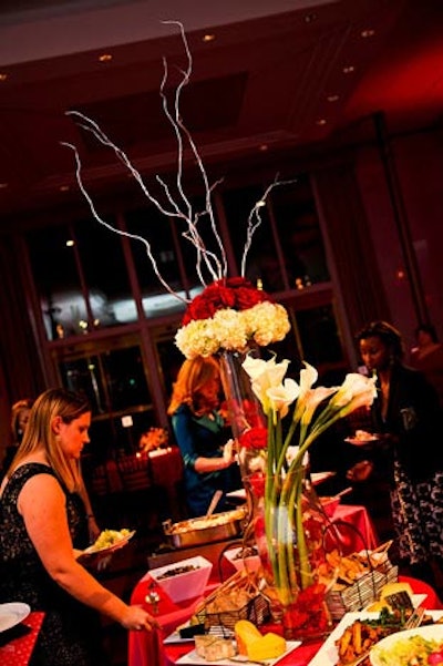 Suzanne Codi topped the buffet tables of the after-party with arrangements of white calla lilies, hydrangeas, and red roses.