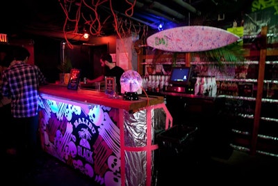 Malibu Rum's Halloween kick-off event took over both floors of Good Units on October 27. Looking to integrate the brand's tropical island sensibility into spooky decor, producers Extra! Extra! decorated bars with surfboards, skull-and-crossbones imagery, and the brand's logo.