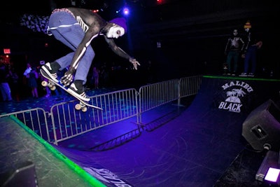 Covered in black and white body paint, the zombie skateboarders maneuvered on and around the ramp, showing off their moves for the crowd.