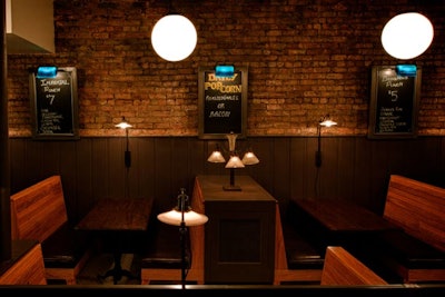 Exposed brick walls, wooden booths, and old-fashioned lighting fixtures fill the first floor. The original building was built in 1892.