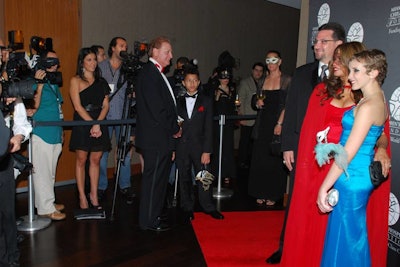 Guests posed for photos on the red carpet in front of a Miami Children's Hospital Foundation step and repeat.