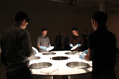 Six performers washed the same six plates for the duration of the night, pausing occasionally to pass them in a circle, assembly line-style.