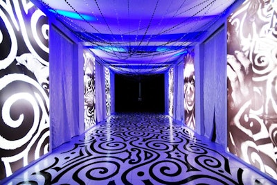 Deco used bold black and white graphics and artwork to turn the walkway from the reception into the ballroom into a mod art gallery. printed on an adhesive transparent