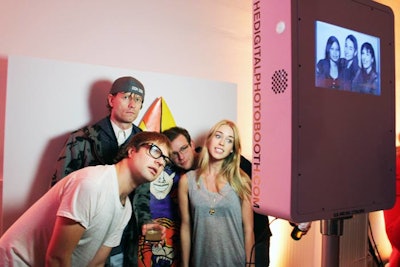 At a photo booth, guests could pose with a surfboard customized with Mambo graphics and artwork.