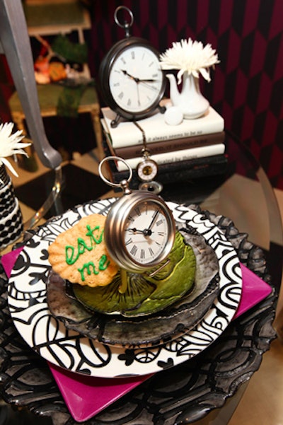 Clocks, plates with mismatched patterns, and cookies decorated the table.