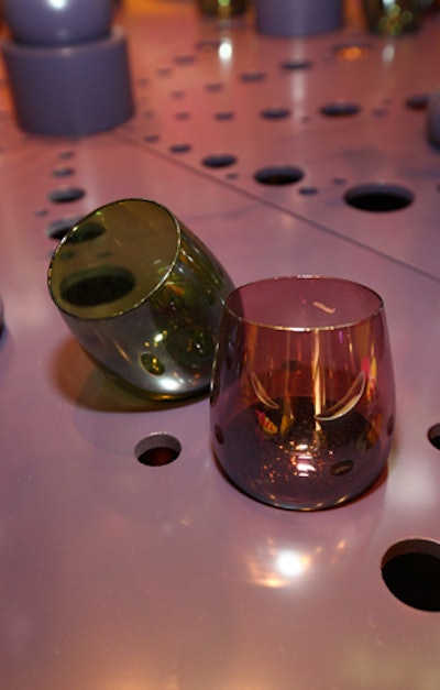 Decorative holes in the table functioned as cup holders.