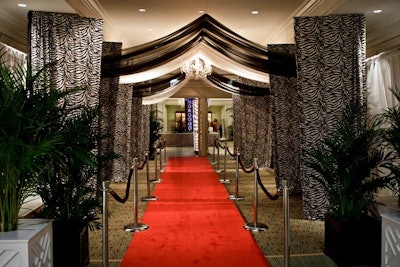 A red carpet, overhung with black drapes, lined the entrance to the cocktail reception.