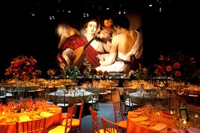 A large print of Caravaggio's The Musicians served as a backdrop for the stage during the V.I.P. dinner. Flowers seemed to float on top of tall, glass centrepieces.