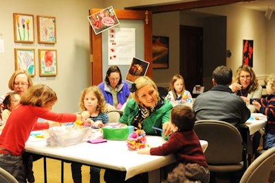 Families participated in an art-making activity, creating tissue paper flowers inspired by the museum’s outdoor sculpture of pink roses by artist Will Ryman.