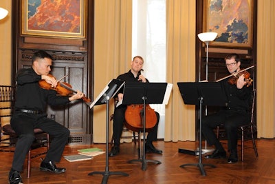 Visitors listened to classical works performed on violin, viola and cello by the Teiber Trio.