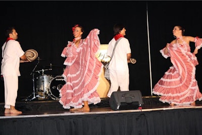Dancers from Colombia performed a lively routine on the stage.