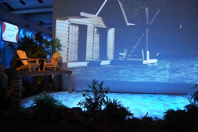 For summer, the Children's Aid team created a fake lake with projections on the floor and on a screen. Muskoka chairs sat on the 'dock.'