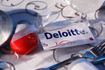 Red macaroons from sponsor Deloitte were at every table.