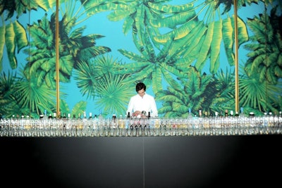 At the concert, two long bars were erected at opposite sides of the space, boasting 18-foot-high walls and the palm-print motif as a backdrop.