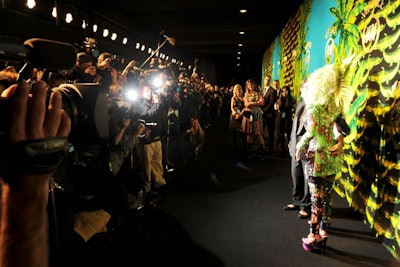 Rather than having guests arrive at a splashy and conspicuous entrance, the event's organizers erected a massive 12-foot-tall step-and-repeat covered with Versace for H&M neon green crocodiles and a palm-print motif inside Pier 57 for V.I.P. arrivals. A 100-foot-long black carpet replaced the traditional red, where attendees like Nicki Minaj, Donatella Versace, and H&M creative advisor Margareta van den Bosch (pictured) posed for the crowd of photographers.