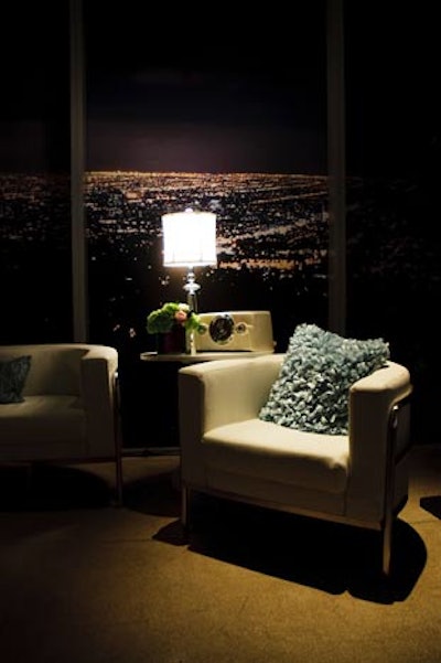 In the BlackBerry Lounge, '50s-inspired chairs, throw pillows, and a radio created the vignettes. The windows were covered with vinyl images of the Los Angeles skyline.