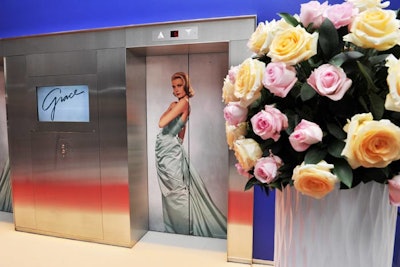 The elevator doors were covered with an image of Grace Kelly. Pastel rose floral arrangements from Jackie O filled the exhibit.