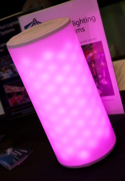 Port Lighting Systems' Event Cylinders, internally illuminated with LED lights, can stand in place of candles to light pathways. They can also be used under tables behind sheer drapes to create glowing registration desks and silent-auction displays.