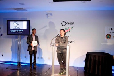 Stoked's achievement award was presented to Paul Rodriguez (pictured, right), a professional skateboarder also known as P-Rod, who supports the nonprofit's programs that give underprivileged youth the opportunity to participate in action sports, including skateboarding, surfing, and snowboarding.