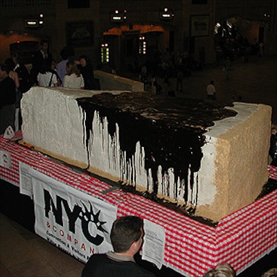 A 12-foot slice of cheesecake baked by Baby Watson, a division of Mother’s Kitchen, was displayed at Grand Central Terminal for the launch of New York’s annual Restaurant Day.