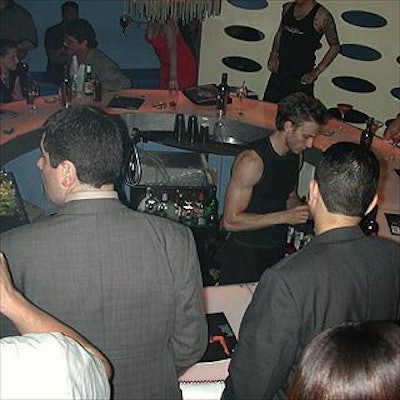 Partygoers crowded the sunken bar in the back room behind the dance floor at Centro-Fly.