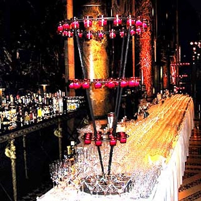 A bar was set up with large tiered candelabras lit with red votive candles.