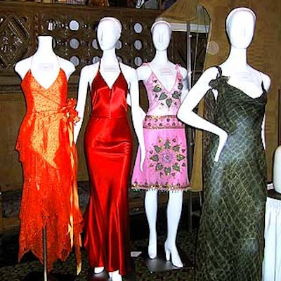 At a silent auction, guests bid on designer dresses.